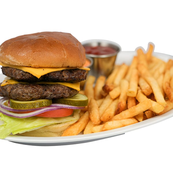 Double cheeseburger with lettuce, tomato, onion, pickles, and a side of golden fries and dipping sauces.