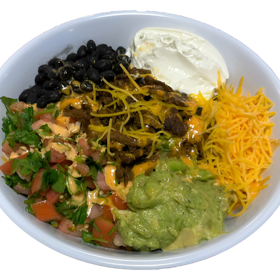 A Black Seed Halal Grill bowl with black beans, meat, shredded cheese, guacamole, and salsa.