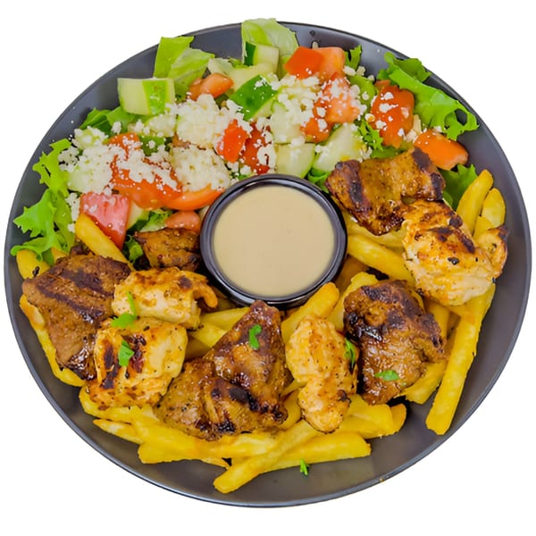 Black Seed Halal Grill's grilled chicken and beef over fries, with salad and dipping sauce.