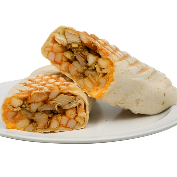 Two halves of a grilled chicken and french fry wrap with cheese on a white plate.